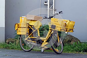 Yellow bicycle of a postman.