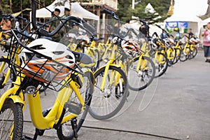 Yellow bicycle for travelers people rent biking tour around Bang Mod festival