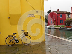 yellow bicycle on the wall, this photo was taken in Copenhagen, Denmark