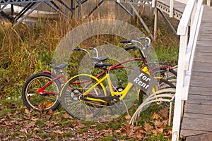 Yellow bike and red tandem bike. Bicycles for rent