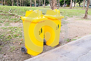 Yellow bins in the park.