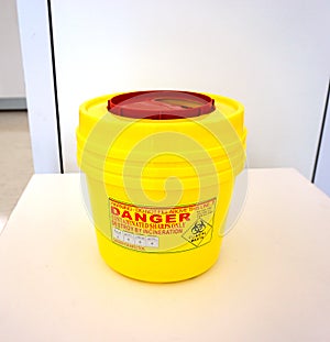 Yellow biohazard medical container