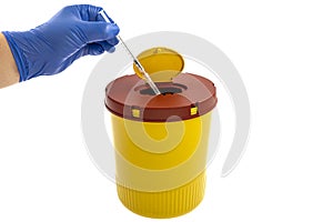 Yellow biohazard medical contaminated sharps clinical waste container isolated on white background