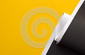 Yellow and black abstract background divided with white stripe