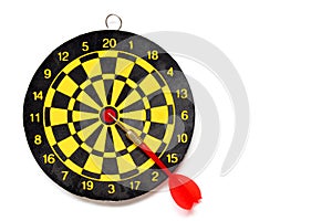 Yellow and black color dartboar with number and dart