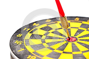 Yellow and black color dartboard with number and have the dart hit at red dot on white background & x28;Concept for business focus