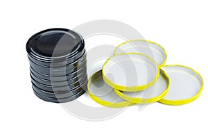 Yellow and black metal jar lids isolated on white