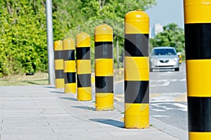 Yellow and black road safety posts