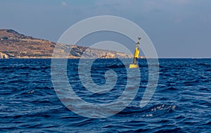 Yellow and black steel navigational floating buoy