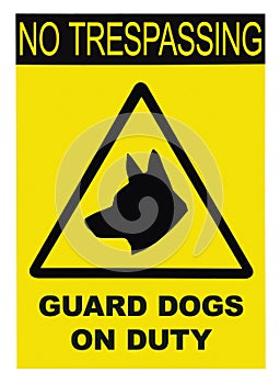 Yellow black triangle No Trespassing Guard Dogs On Duty Text Sign, isolated, large detailed closeup photo