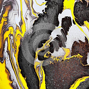 Yellow black waves and gold inclusions. Abstract stone background or texture. Acrylic Fluid Art