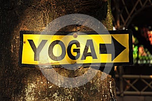 Yellow and black yoga signboard