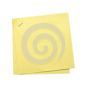 Yellow blank paper note memo with a metal staples isolated on white background