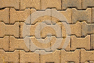 Yellow block pavior driveway. Seamless texture of street tiles. Pattern of yellow sidewalk tiles. Paved path pattern, brick path
