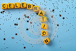 Yellow blocks arranged in celebraion word flat lay.