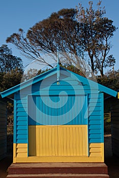 A yellow-blue bathing box at the Brighton Beach in Melbourne