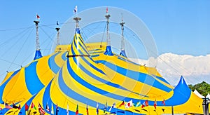 A yellow and blue circus tent.