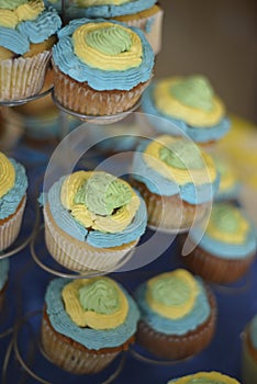 Yellow, blue and green cupcakes