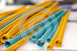 Yellow and blue metal coil spring equipment part of appliance machine in manufacturing process or automotive or different