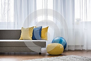 Yellow and blue pillows on couch