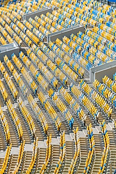 Yellow and blue stadium seats and stadium stairs