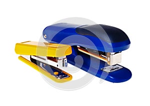 Yellow and blue staplers (isolated).