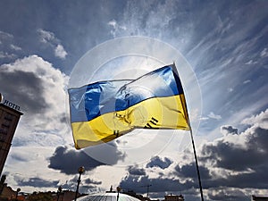 Yellow and blue Ukrainian flag flying on wind