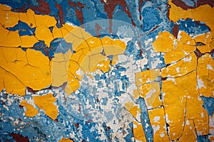 Yellow, blue, white, brown abstract vintage background. Old peeling paint on the wood surface, weathered texture