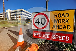 Road work ahead reduce speed 40 KM/H speed limited zone safety warning sign photo