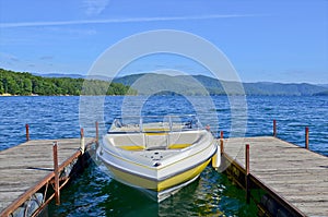 Yellow Boat at Dock on a Lake