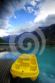 Yellow boat and fjord