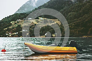 Yellow boat fjord and foggy Mountains Landscape