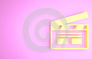 Yellow Bollywood indian cinema icon isolated on pink background. Movie clapper. Film clapper board. Cinema production or