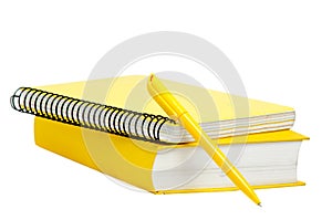 Yellow book, copybook and pen