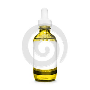 Yellow bottle with pipette. dropper bottle with serum. cosmetic oil on white background. essential oils isolated. natural oil