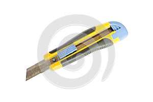 Yellow box cutter with rusty blade isolated on white background