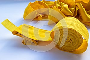 Yellow boxing hand bandage wraps on white background. Sports equipment for boxing. Top view