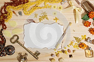 Yellow and Brown Jewelry and Decorations with Vintage Key and Blank Paper With Burned Edges