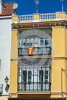Yellow Building and Spanish Flag
