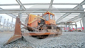 Yellow bulldozer at the construction site. Bulldozer at the construction site. Heavy construction equipment