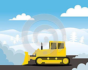 Yellow bulldozer pushing pile of snow photo