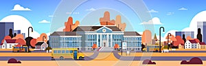 Yellow bus in front of autumn school building yard pupils transport concept 1 september cityscape background banner flat