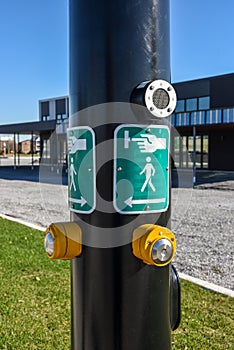 Yellow button and road signs pedestrian crossing