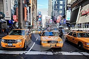 Yellow cab and busy Time Square