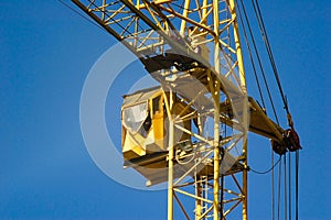 Yellow cab of a construction hoisting crane photo