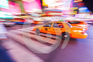 Yellow cab in NYC in motion blur photo
