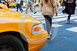 Yellow cab at the pedestrian crossing in Manhattan, NYC