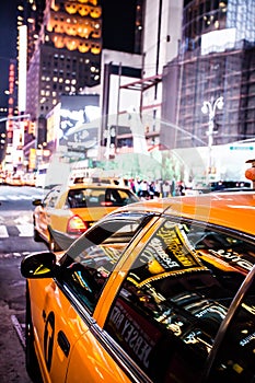 Yellow cab speeds through Times Square in New York.