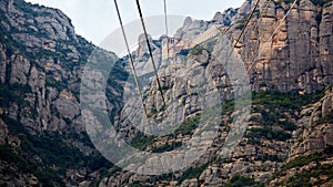 Yellow cable car in the Aeri de Montserrat rise to de Montserrat Abbey near Barcelona, Spain, Catalonia.