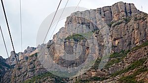 Yellow cable car in the Aeri de Montserrat rise to de Montserrat Abbey near Barcelona, Spain, Catalonia.